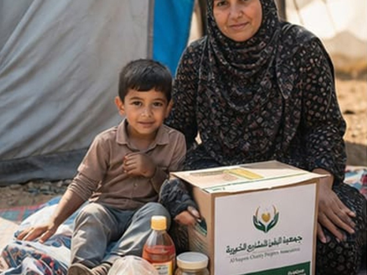 Mother and child with a food support parcel